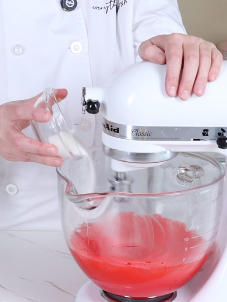 Add sugar to the mixing bowl. 