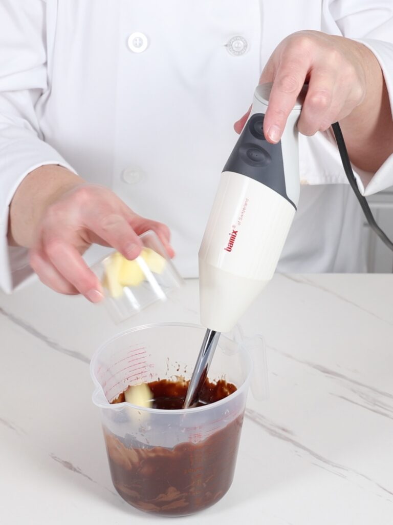 Add butter to the peppermint ganache. 