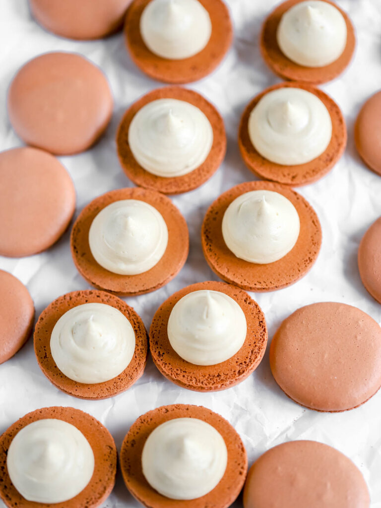 Biscoff Cookie Butter frosting on the macaron shells. 
