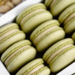 Pistachio Cheesecake Macarons in the box.