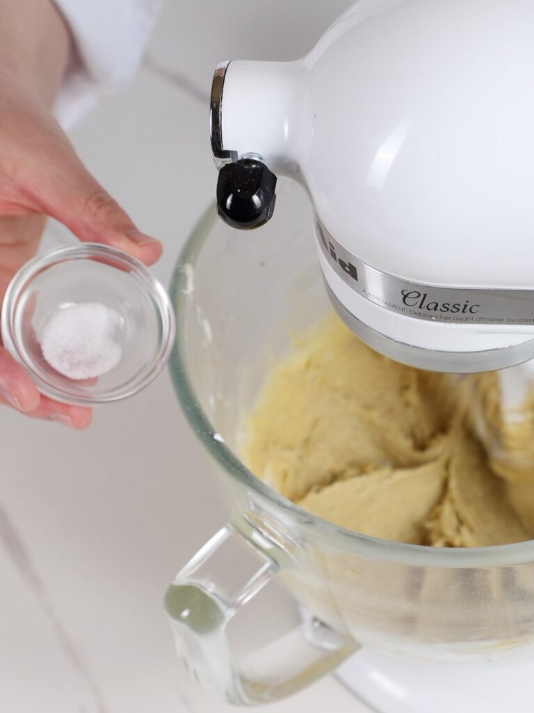 Add salt to the mixing bowl.