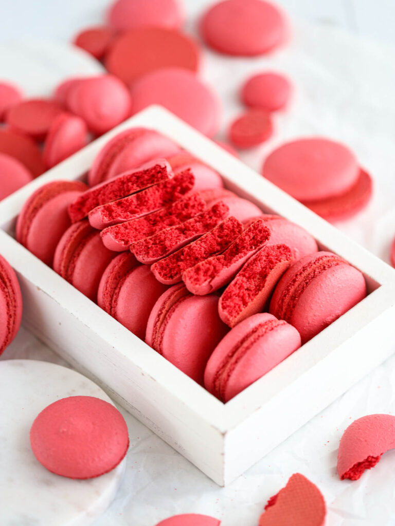 Broken macaron shells on the table. 