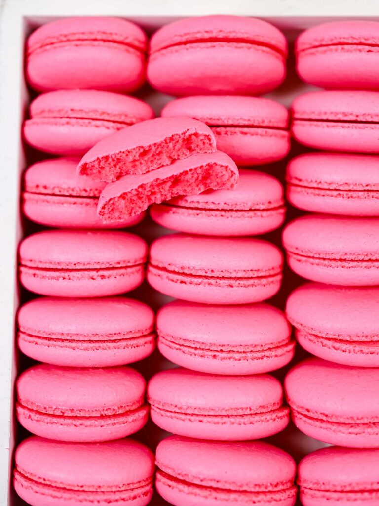 Broken macaron shells on the table.