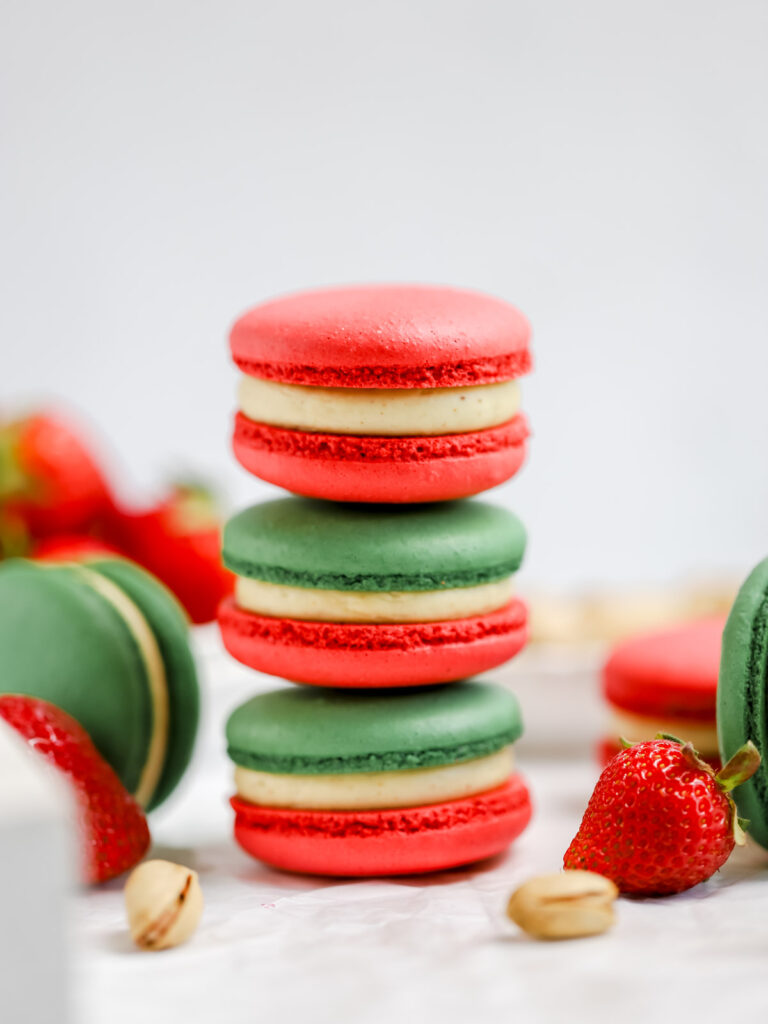 Stock of red and green macarons. 