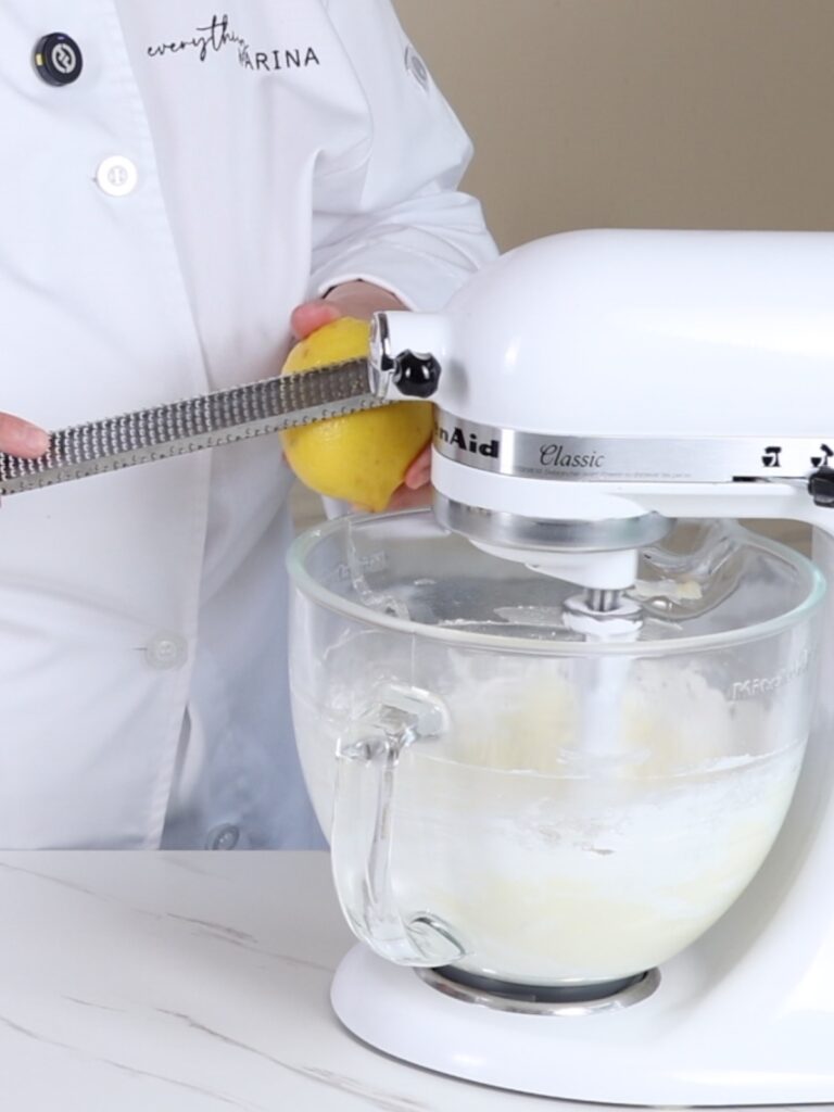 Add lemon zest to the mixing bowl. 
