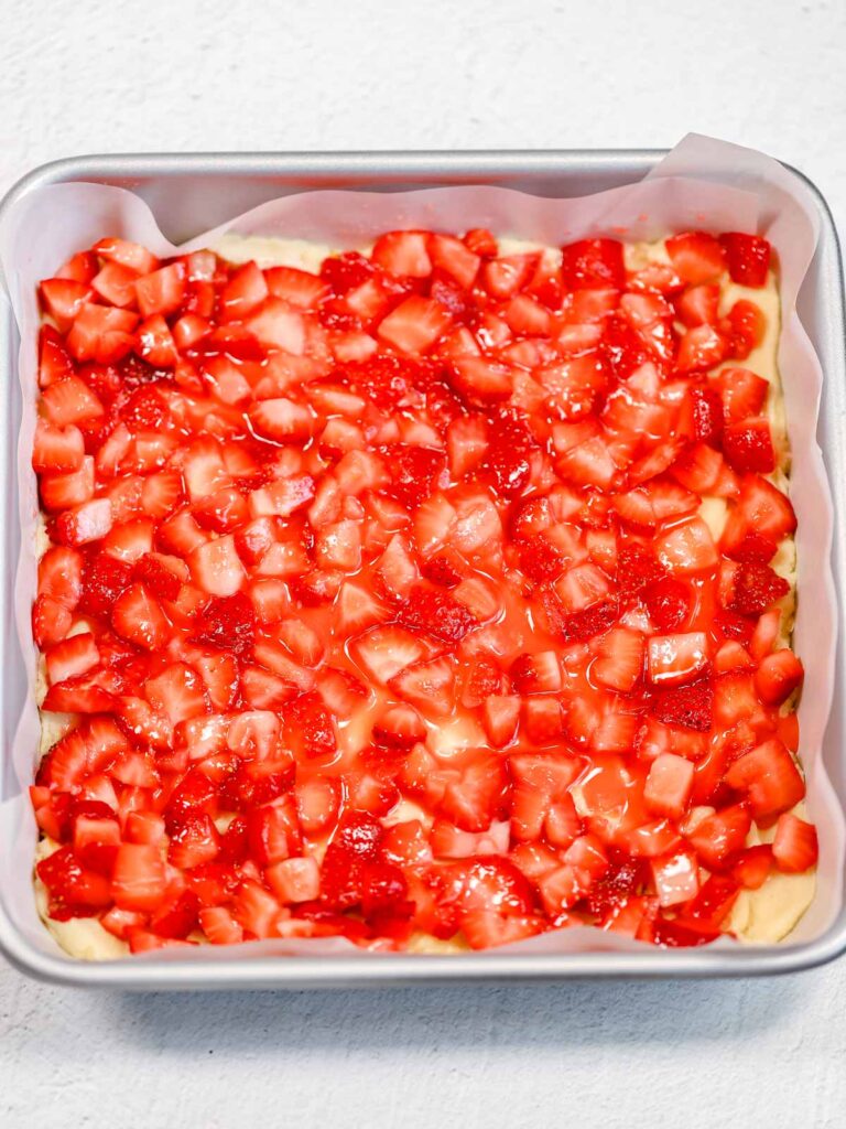 Strawberry filling in the baking pan. 