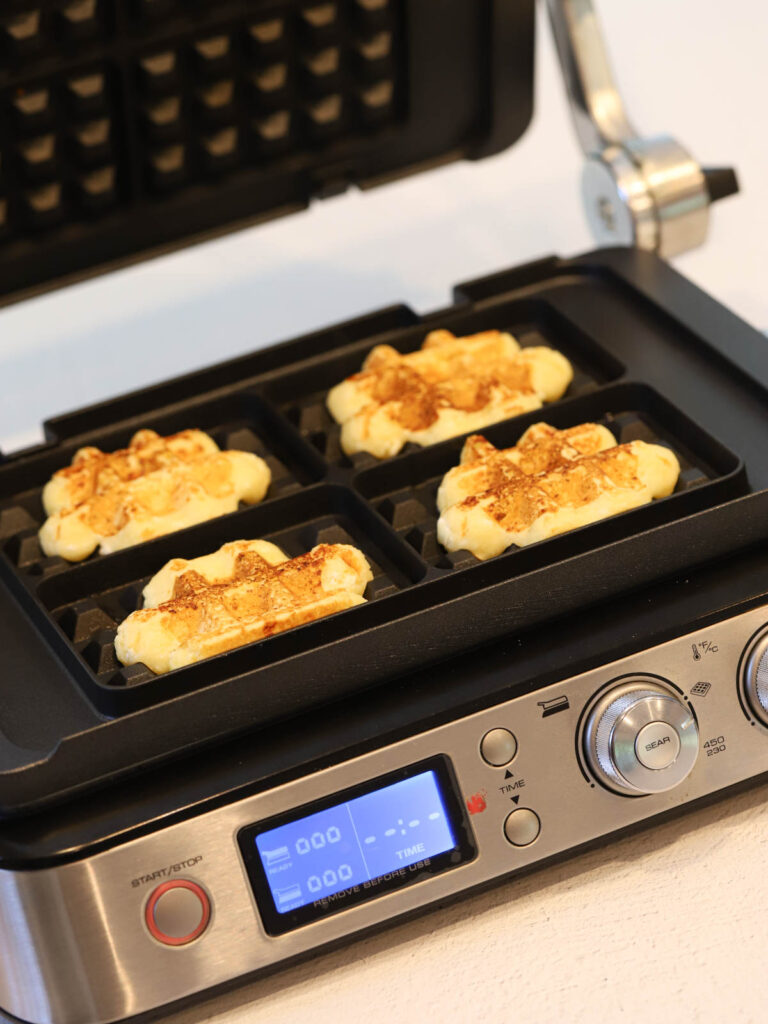 Waffles in the waffle maker. 