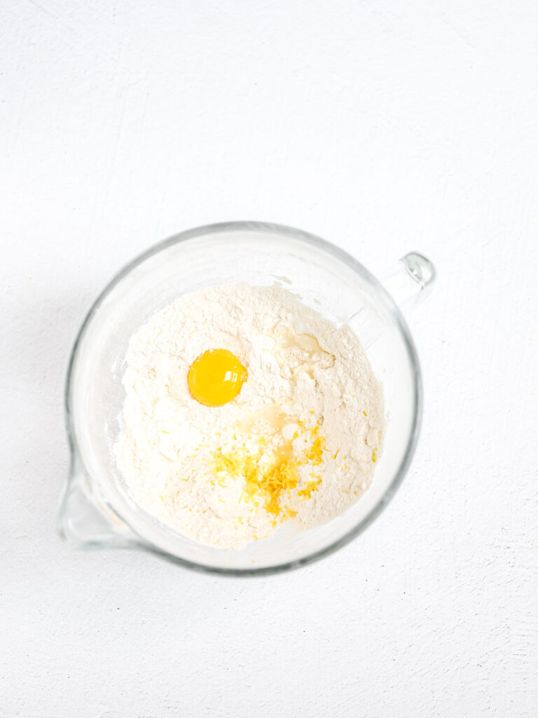 Dry ingredients and egg yolk in the mixing bowl. 
