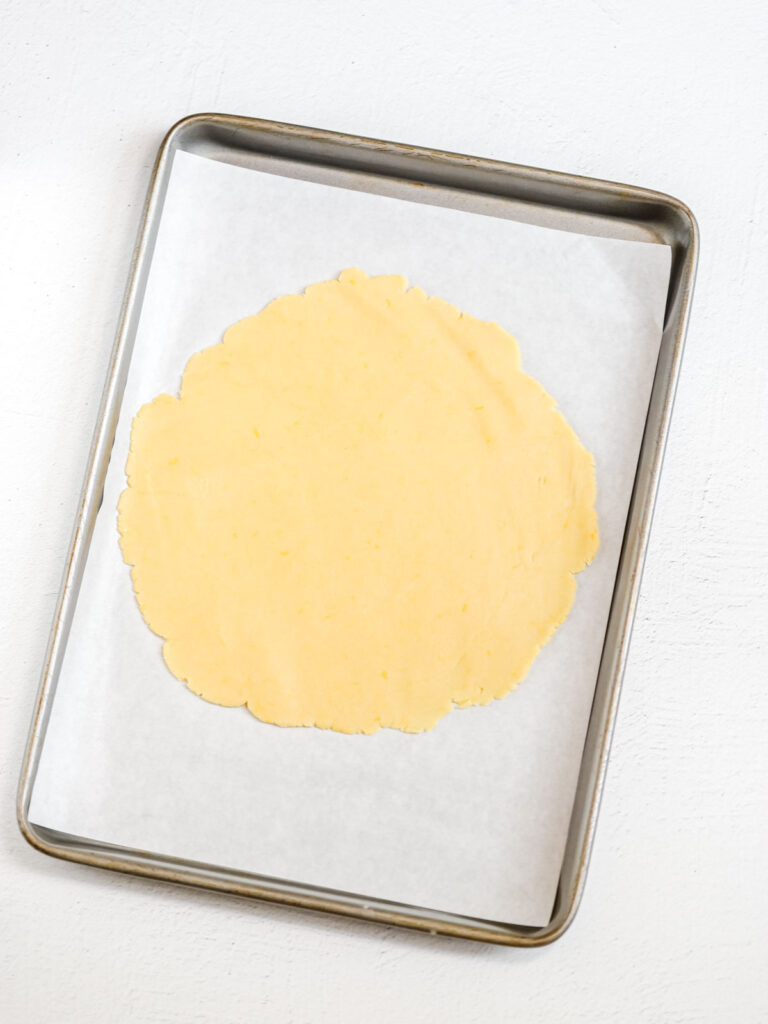 Galette dough on the parchment paper. 