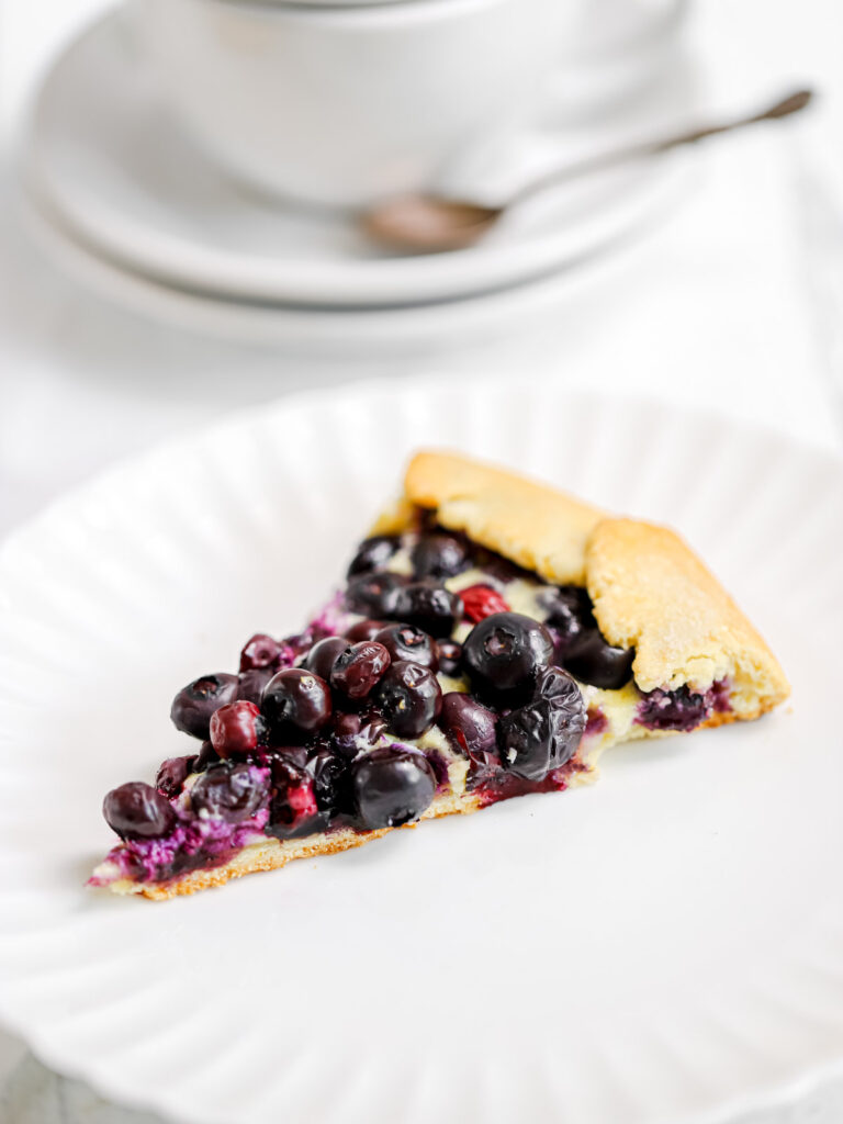 Slice of blueberry galette on the plate. 