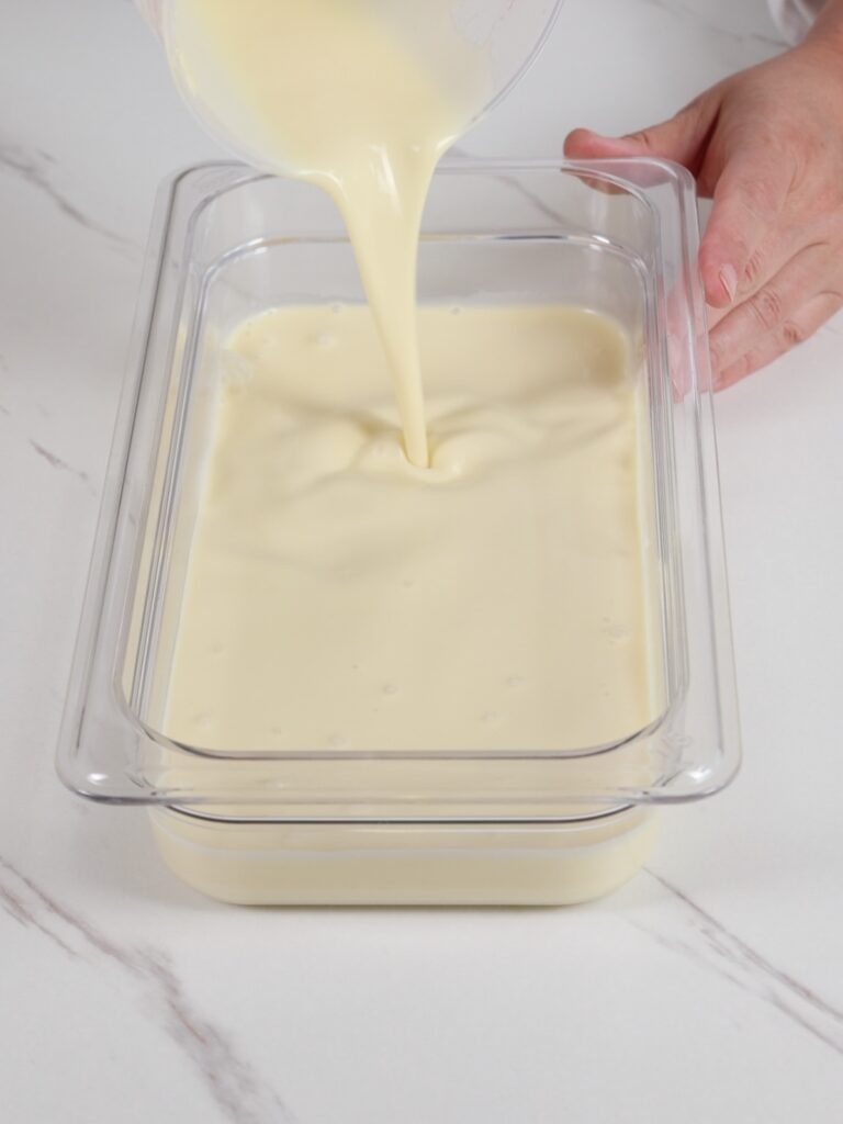 Mango ganache in the container.
