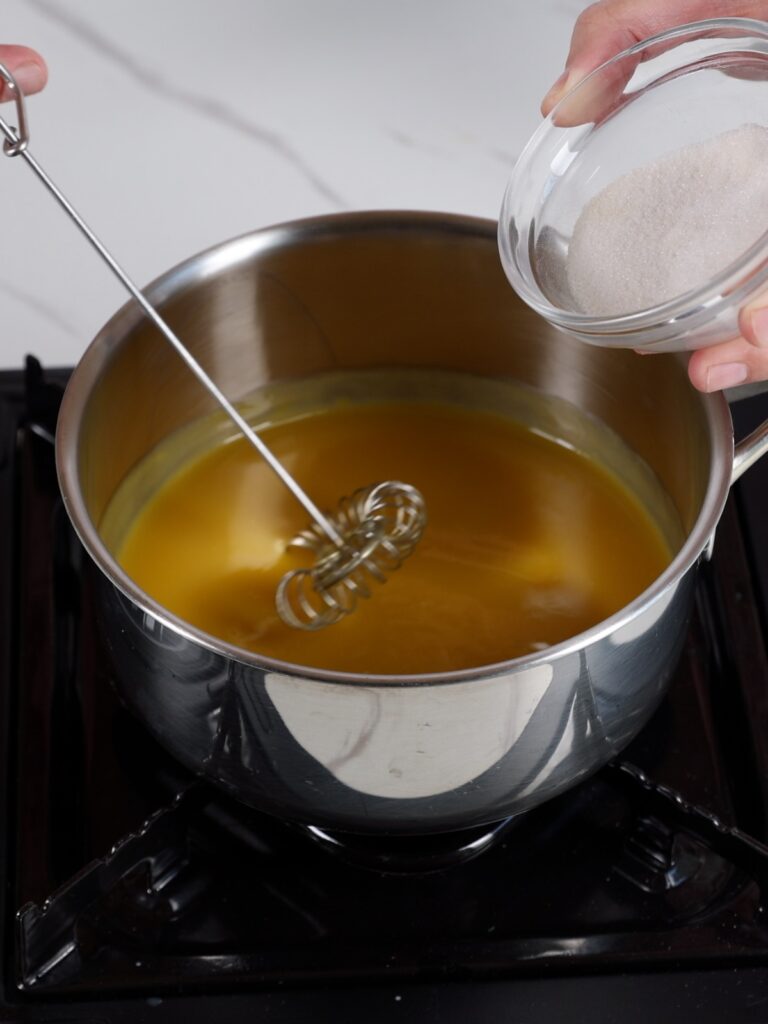 Mango puree in the saucepan.