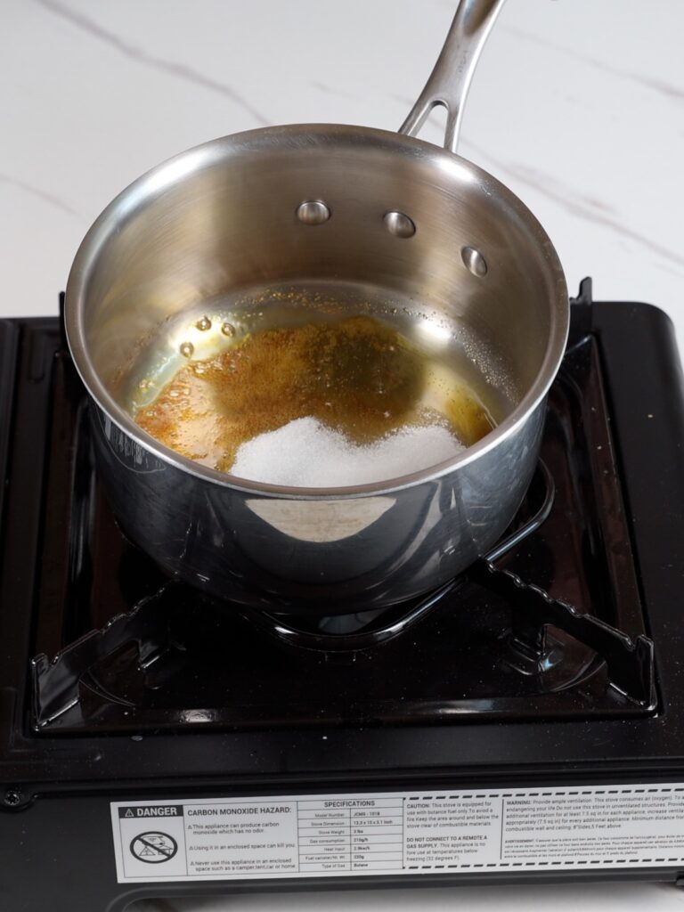 Saucepan with melted sugar.