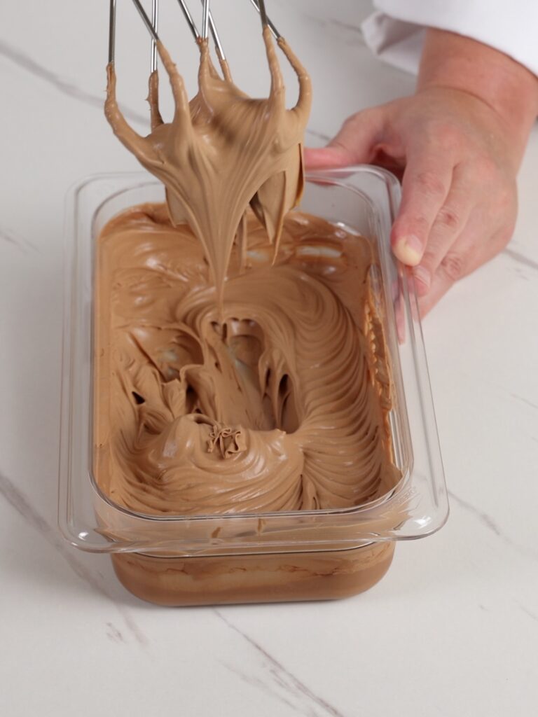Caramel whipped ganache in the container.