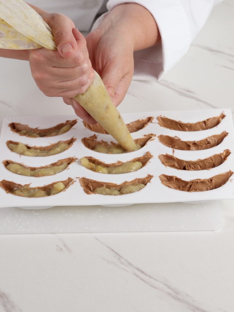 Assembling banana dessert.