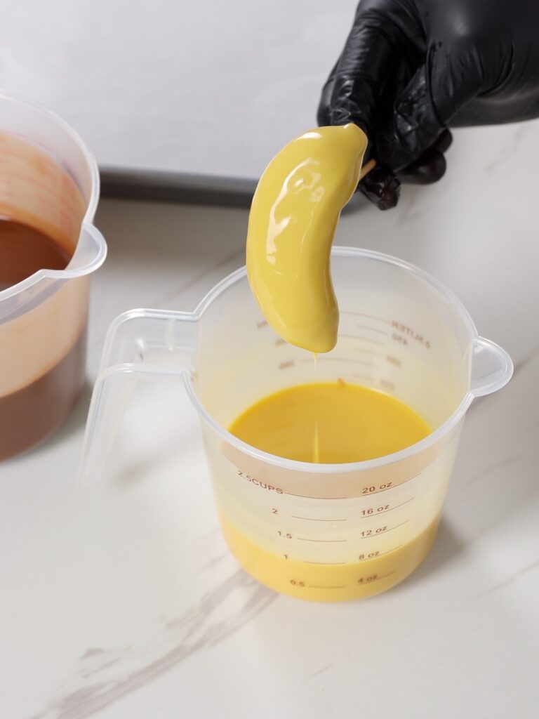 Assembling banana dessert.