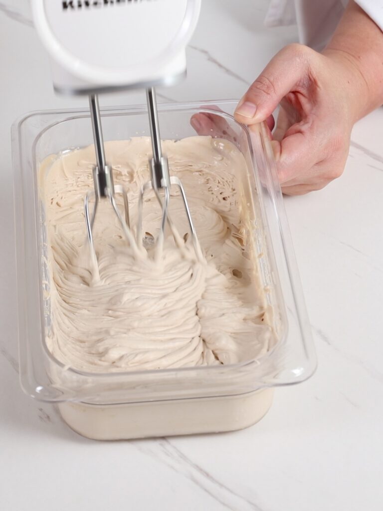Whipped coffee ganache in the container.