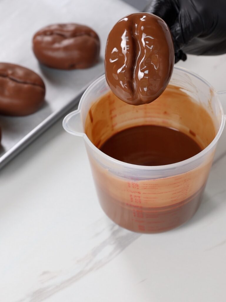 Coffee bean dessert dipped into chocolate coating. 