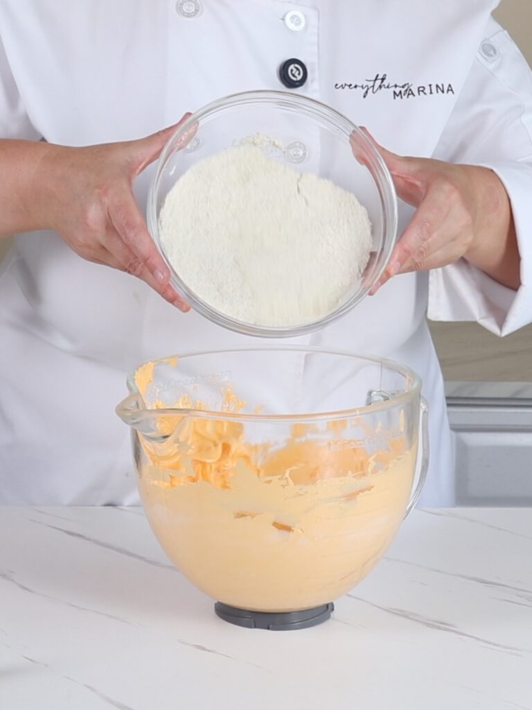 Adding dry ingredients to French meringue. 