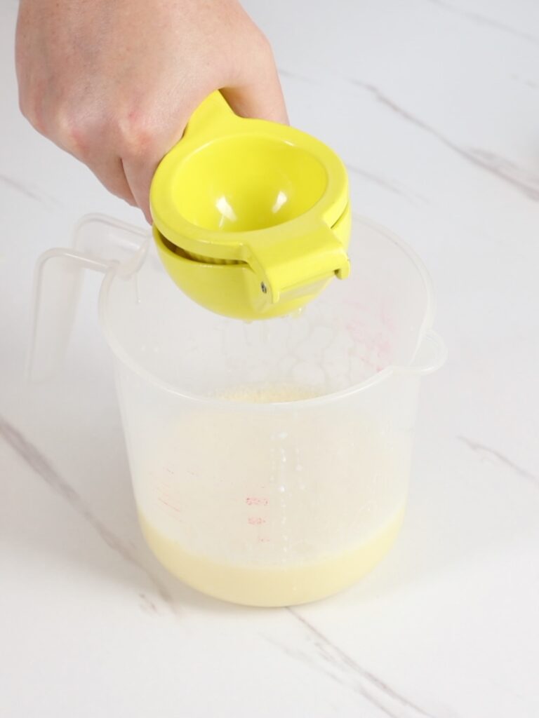 Adding lemon juice into ganache.