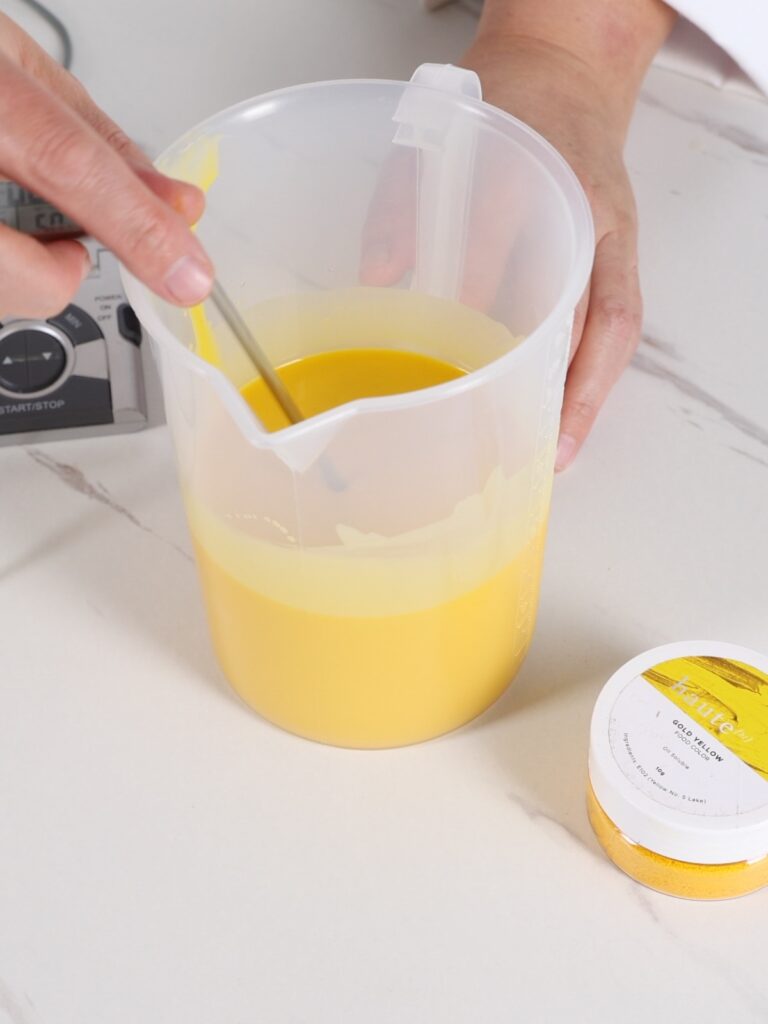 Yellow chocolate coating in the cup. 