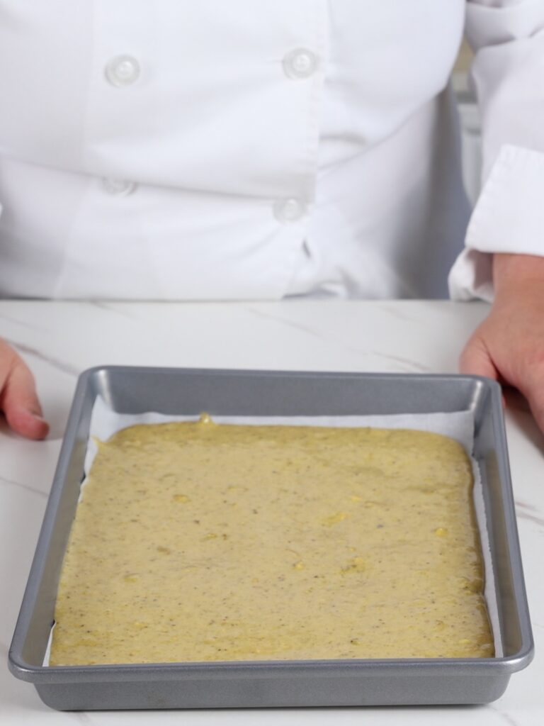 Pistachio cake on the baking tray. 