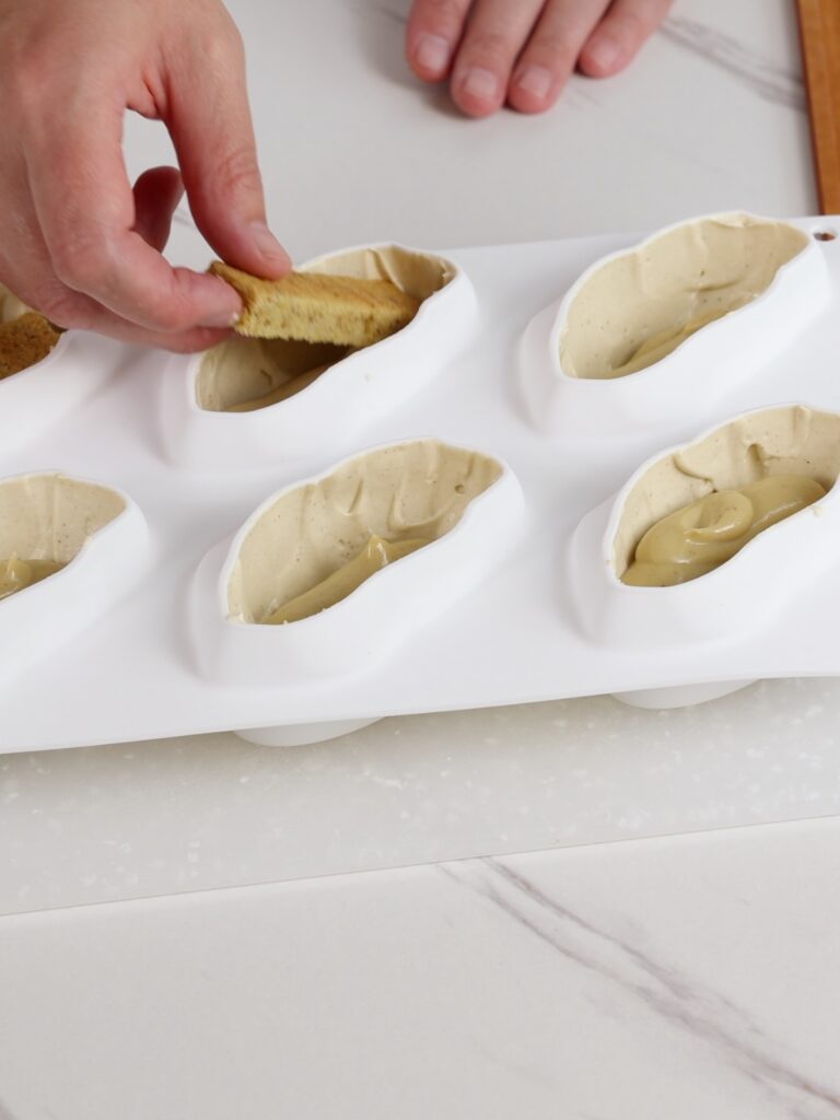 Assembling pistachio dessert. 